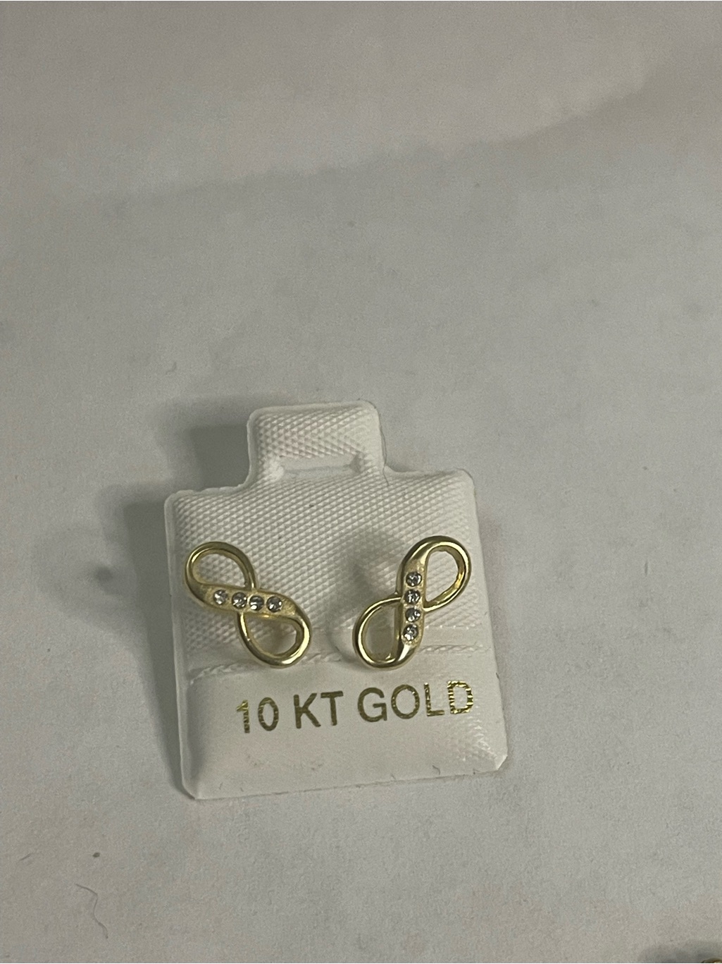 10k Yellow Gold Infinity Stud Earrings Feature Small Cz Stones In A Polished